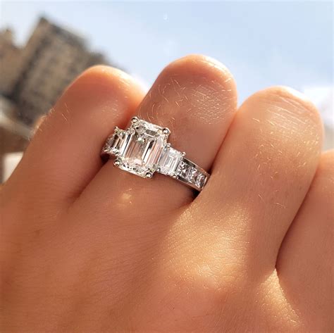 emerald cut engagement ring with chanel set diamonds|channel set diamond rings.